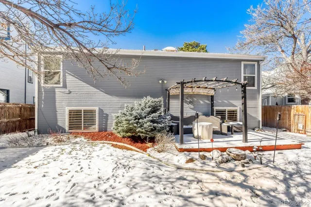 a front view of a house with outdoor seating