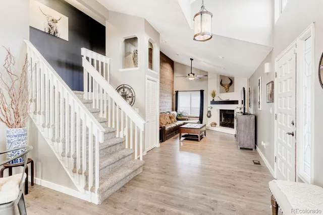 a view of entryway livingroom and hall with wooden floor
