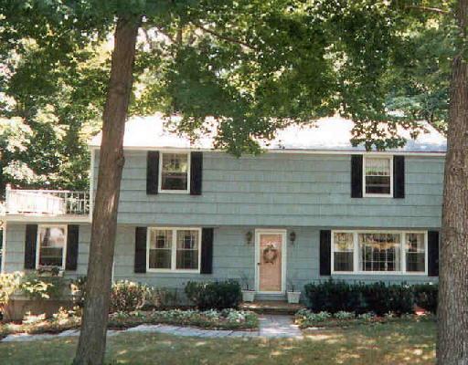 78 Poplar Road Ridgefield, CT 06877 - Photo 1 of 1 a front view of a house with yard and garage