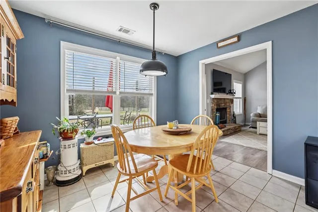 a dining room with furniture and window