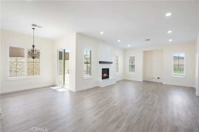 a white toilet sitting next to a bath tub