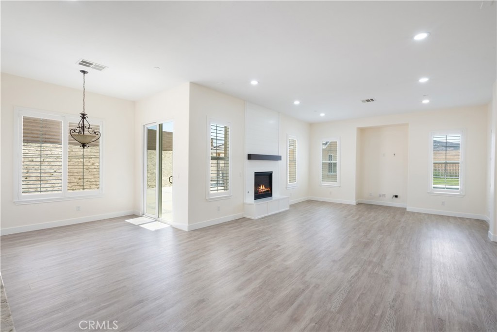 3086 Crystal Ridge Lane Colton, CA 92324 - Photo 15 of 71 a view of empty room with wooden floor and window
