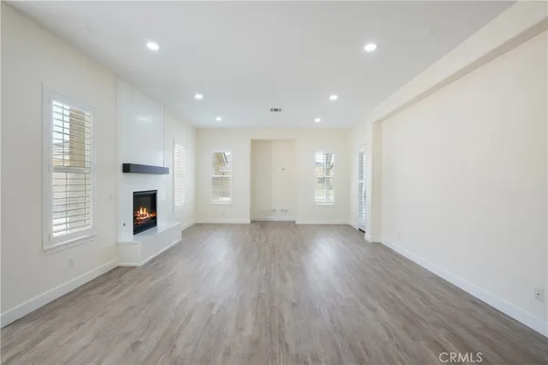 a view of hallway with wooden floor
