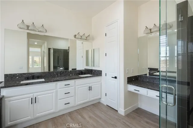 a view of an house with backyard space and balcony