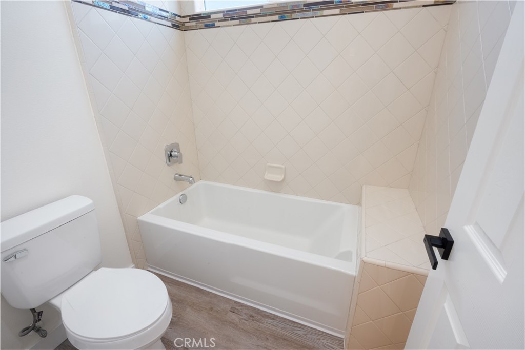 3086 Crystal Ridge Lane Colton, CA 92324 - Photo 35 of 71 a white toilet sitting next to a bath tub