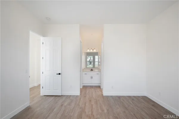 a view of a hallway with washer and dryer