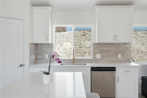 a view of swimming pool with yard in front of it