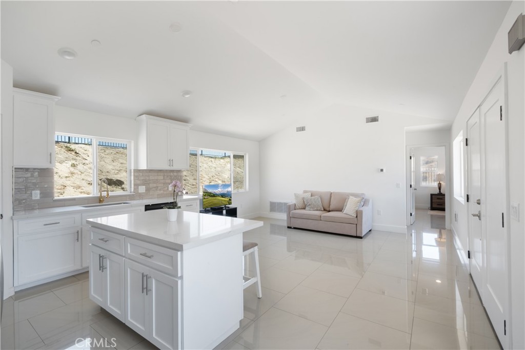 3086 Crystal Ridge Lane Colton, CA 92324 - Photo 48 of 71 a kitchen with white cabinets and sink