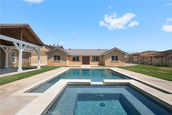a kitchen with a sink cabinets and window