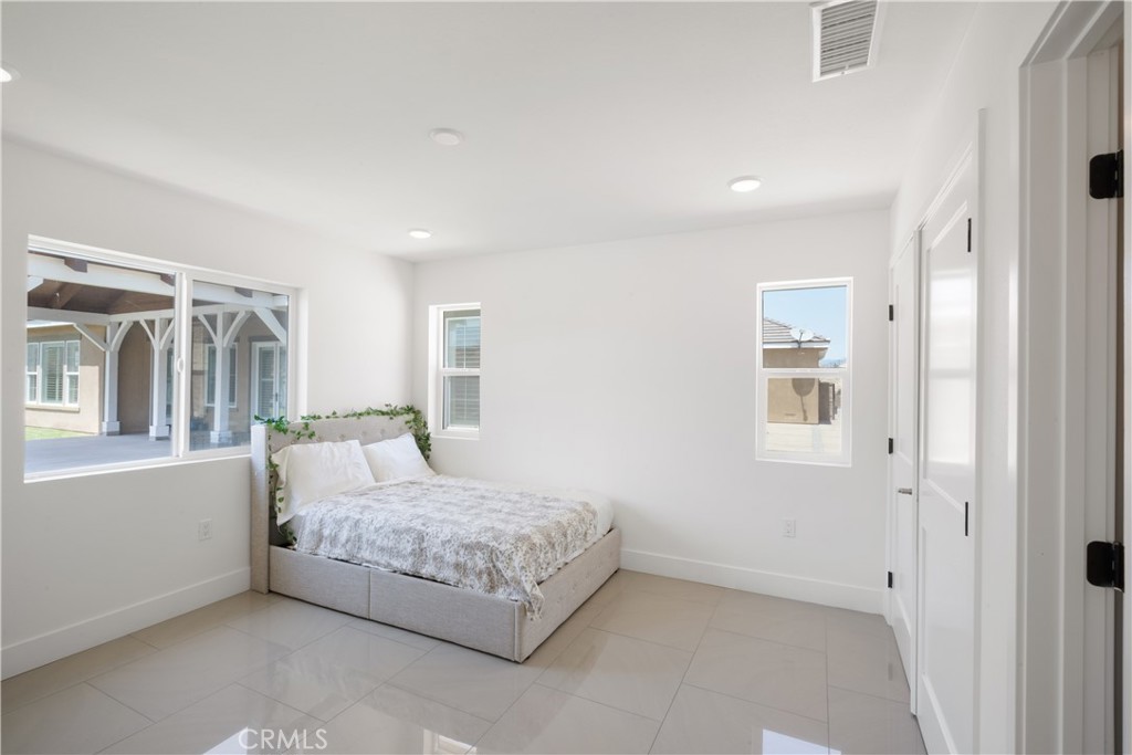 3086 Crystal Ridge Lane Colton, CA 92324 - Photo 56 of 71 a room with a bed and a cabinets