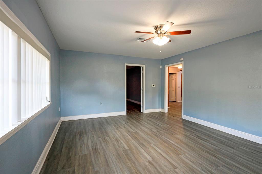 2011 East 148th Avenue Lutz, FL 33559 - Photo 2 of 37 a view of a livingroom with a ceiling fan and window