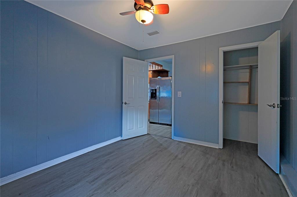 2011 East 148th Avenue Lutz, FL 33559 - Photo 21 of 37 wooden floor in an empty room with a window