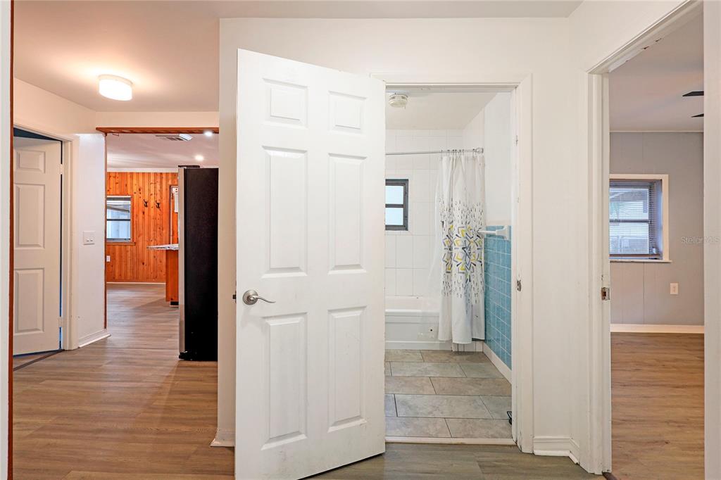 2011 East 148th Avenue Lutz, FL 33559 - Photo 5 of 37 a view of a hallway with wooden floor and closet area
