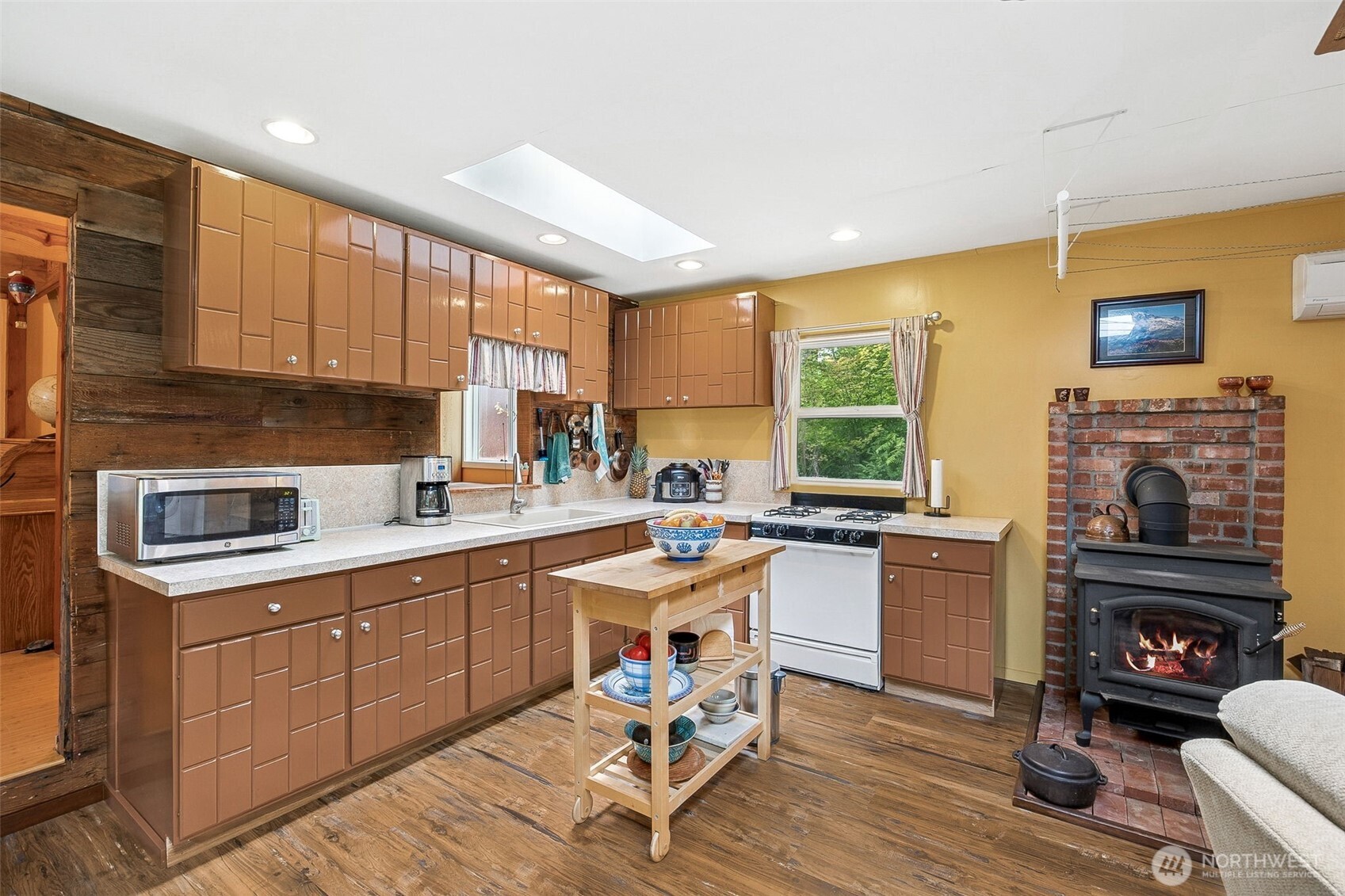 701 Mineral Hill Road Mineral, WA 98355 - Photo 13 of 40 a kitchen with a sink a stove cabinets and dining table