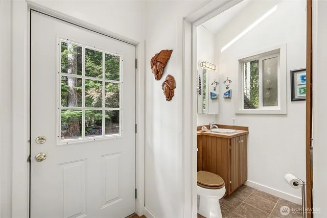 a view of living room filled with furniture and wooden floor