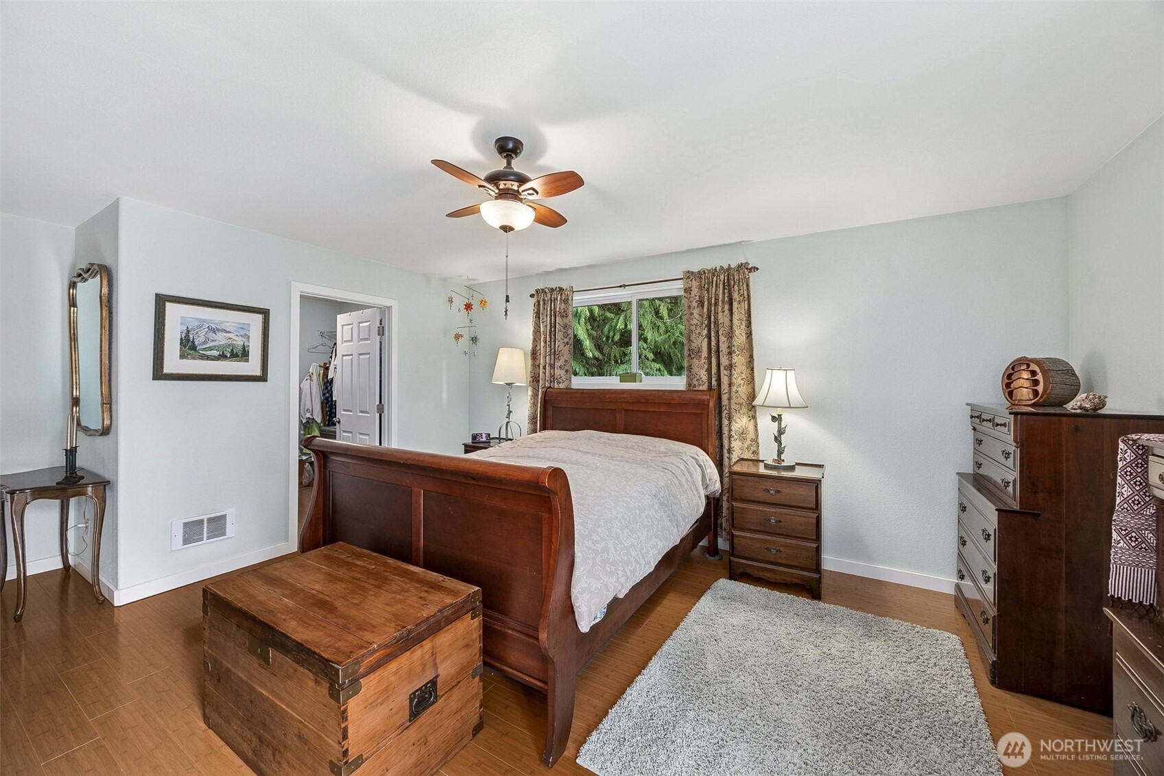 701 Mineral Hill Road Mineral, WA 98355 - Photo 22 of 40 a bedroom with a bed and a chandelier