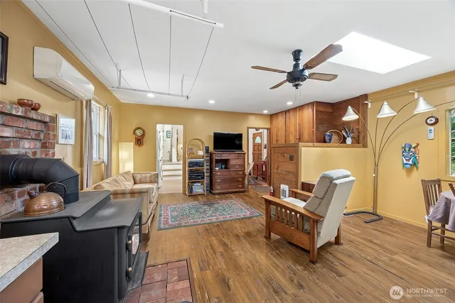 a living room with furniture and kitchen view