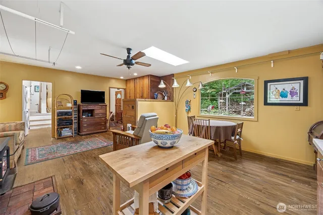 a view of a dining room with furniture window and wooden floor