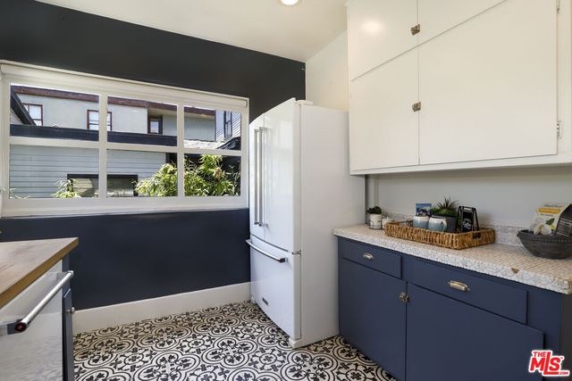 a kitchen with stainless steel appliances a refrigerator and sink