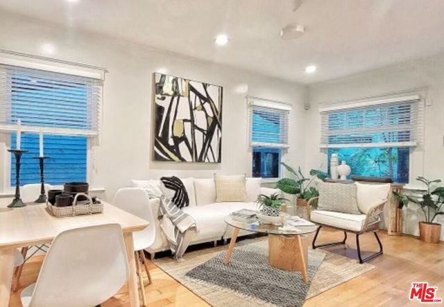 a living room with furniture or couch and a window