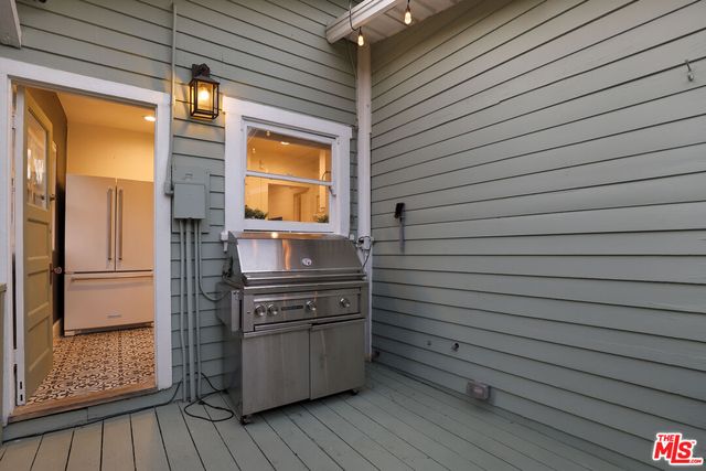 a kitchen with stainless steel appliances and cabinets