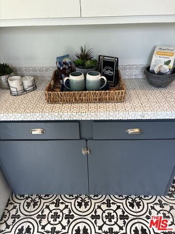 a table with a potted plant and two stove
