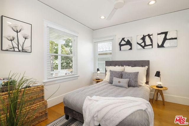 a bedroom with bed and window