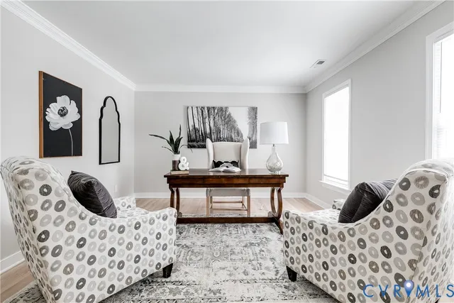 a view of a bedroom with furniture and window