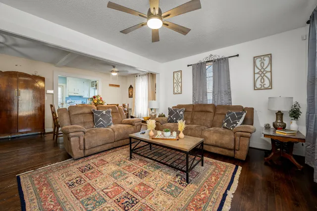 a living room with furniture and a rug