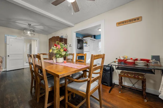 a dining room with furniture and window