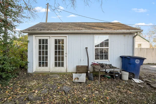 a front view of a house with outdoor seating