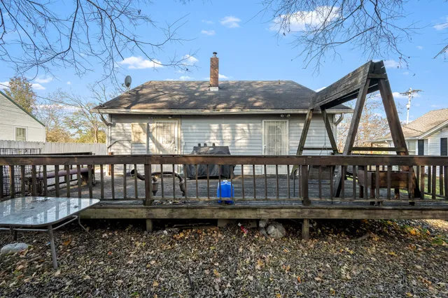 a front view of a house with balcony and outdoor seating