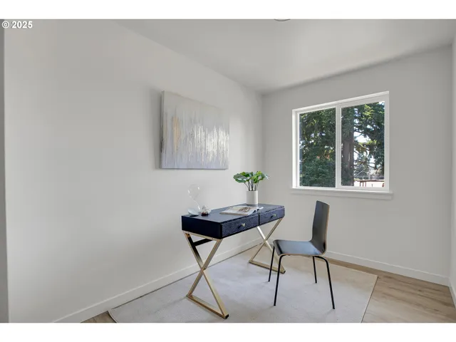 a room with furniture and a potted plant