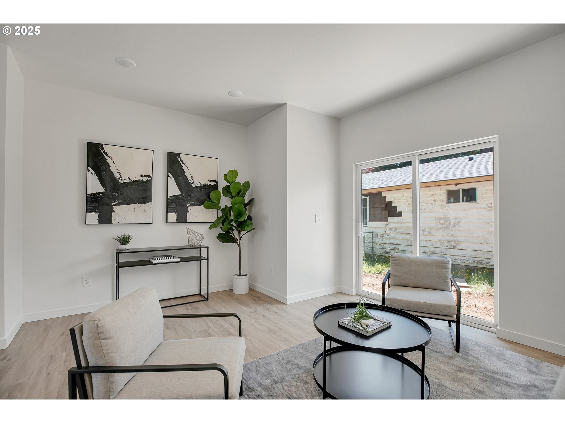 14858 Northeast Couch Street, Unit 10 Portland, OR 97230 - Photo 10 of 42 a living room with furniture and a potted plant