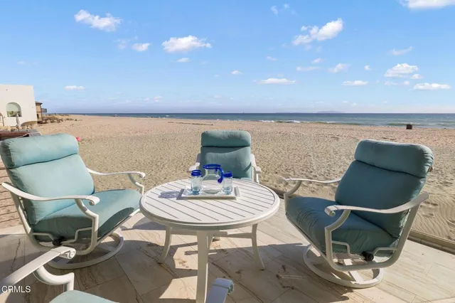 a view of a patio with furniture and a potted plant