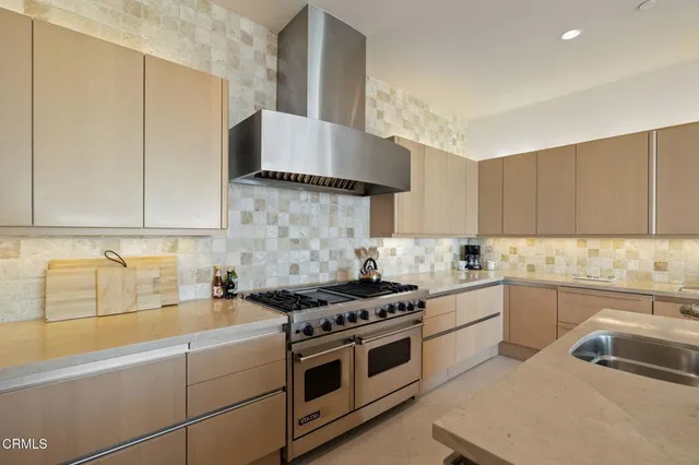 a very nice looking room with a large window and chandelier