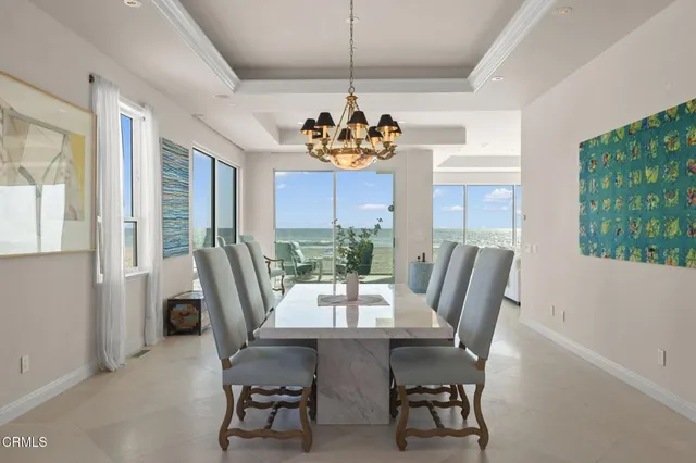 a dining room with furniture window and wooden floor