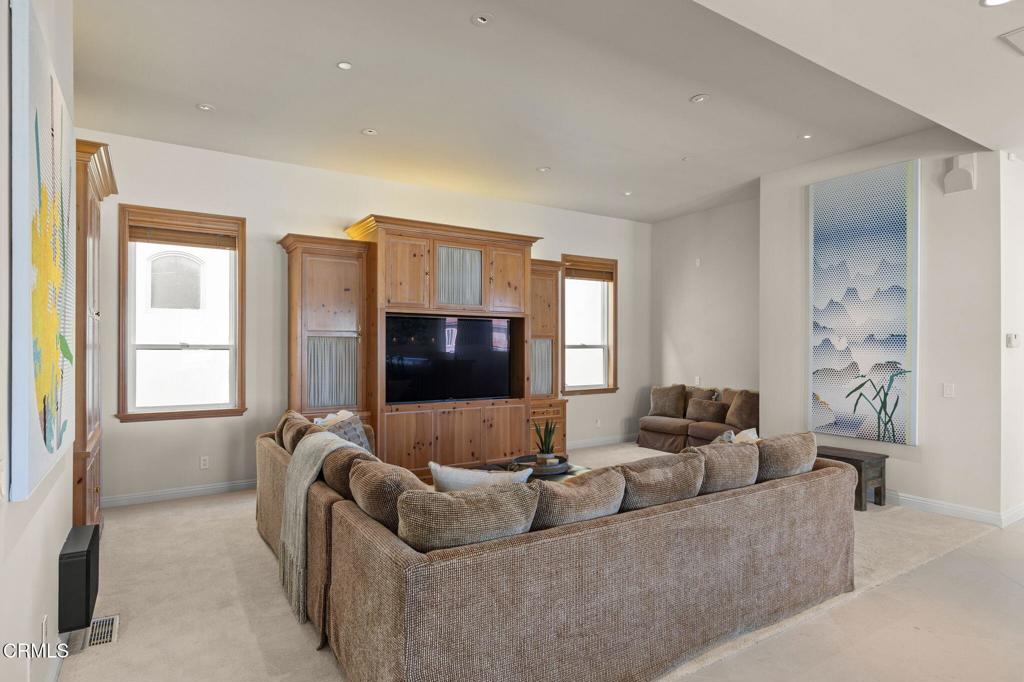 1135 Capri Way Oxnard, CA 93035 - Photo 18 of 62 a living room with furniture and a flat screen tv