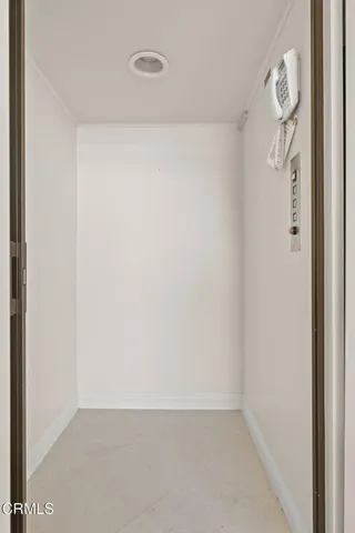 a large bedroom with a large bed and a couch