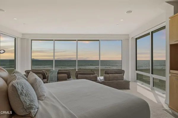 a view of a living room and a large window