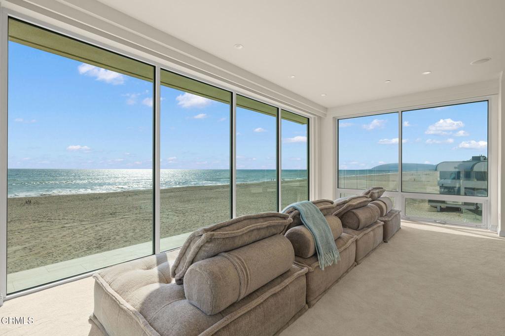 1135 Capri Way Oxnard, CA 93035 - Photo 31 of 62 a balcony with furniture and a floor to ceiling window