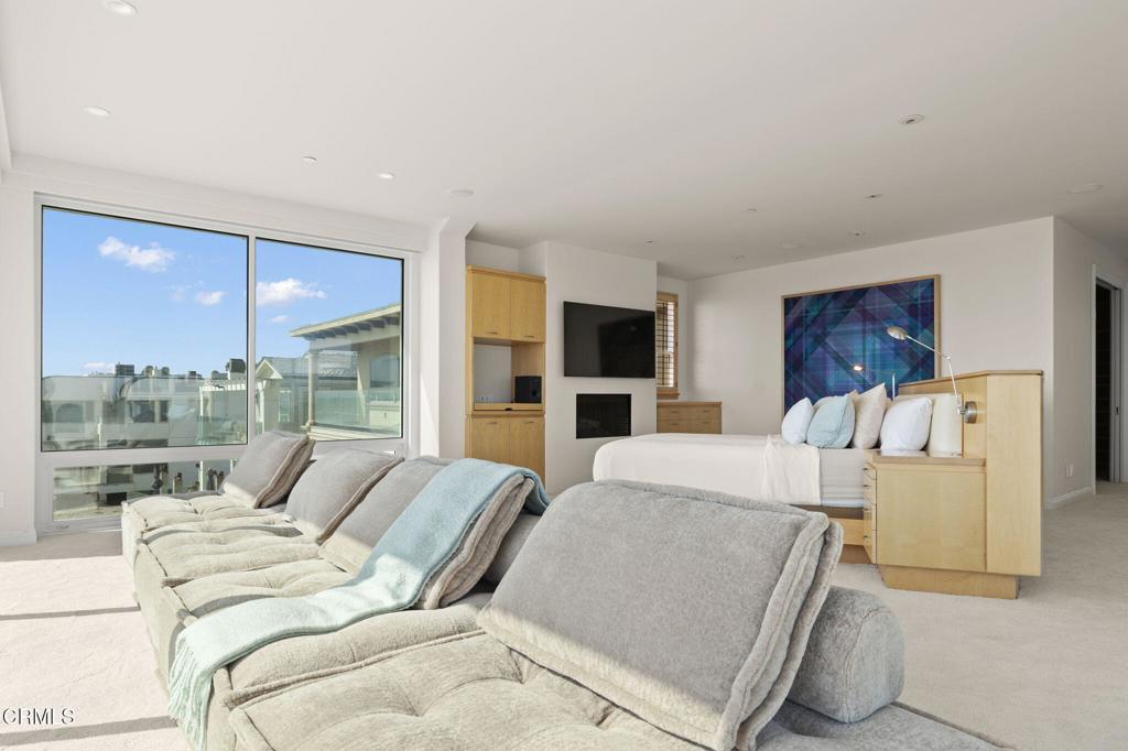 1135 Capri Way Oxnard, CA 93035 - Photo 35 of 62 a living room with furniture and a large window