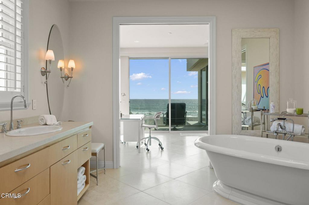 1135 Capri Way Oxnard, CA 93035 - Photo 39 of 62 a spacious bathroom with a double vanity sink mirror and a bathtub