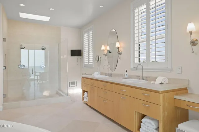 a spacious bedroom with two beds and a couch