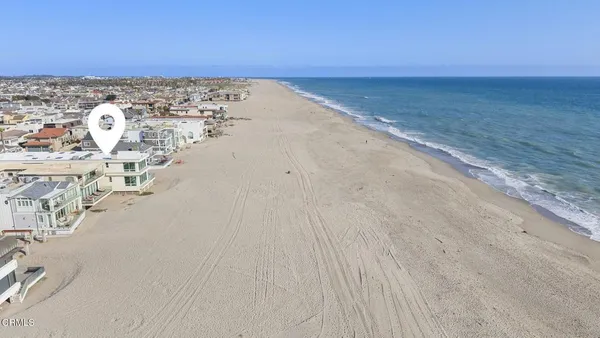 a view of a hallway with wooden floor and entryway