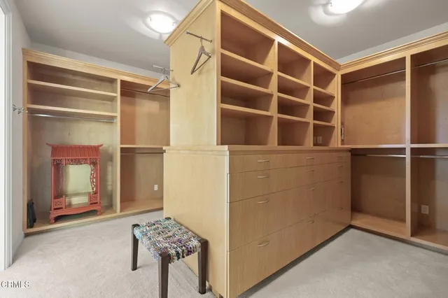 a bed room with a bed and a flat screen tv