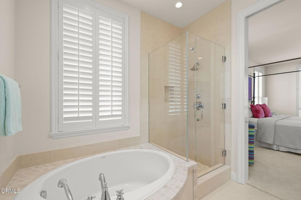 1135 Capri Way Oxnard, CA 93035 - Photo 52 of 62 a white bath tub sitting next to a shower