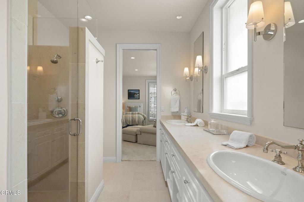 1135 Capri Way Oxnard, CA 93035 - Photo 57 of 62 a spacious bathroom with a double vanity sink mirror and shower