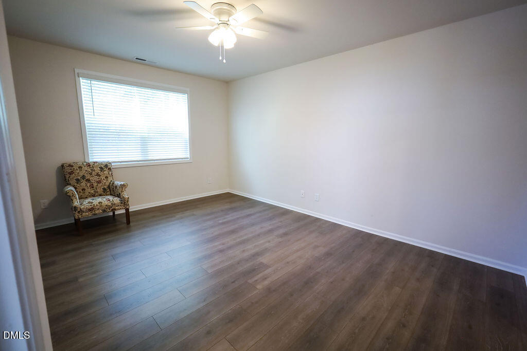 1644 Abberly Place Graham, NC 27253 - Photo 19 of 33 an empty room with wooden floor and windows