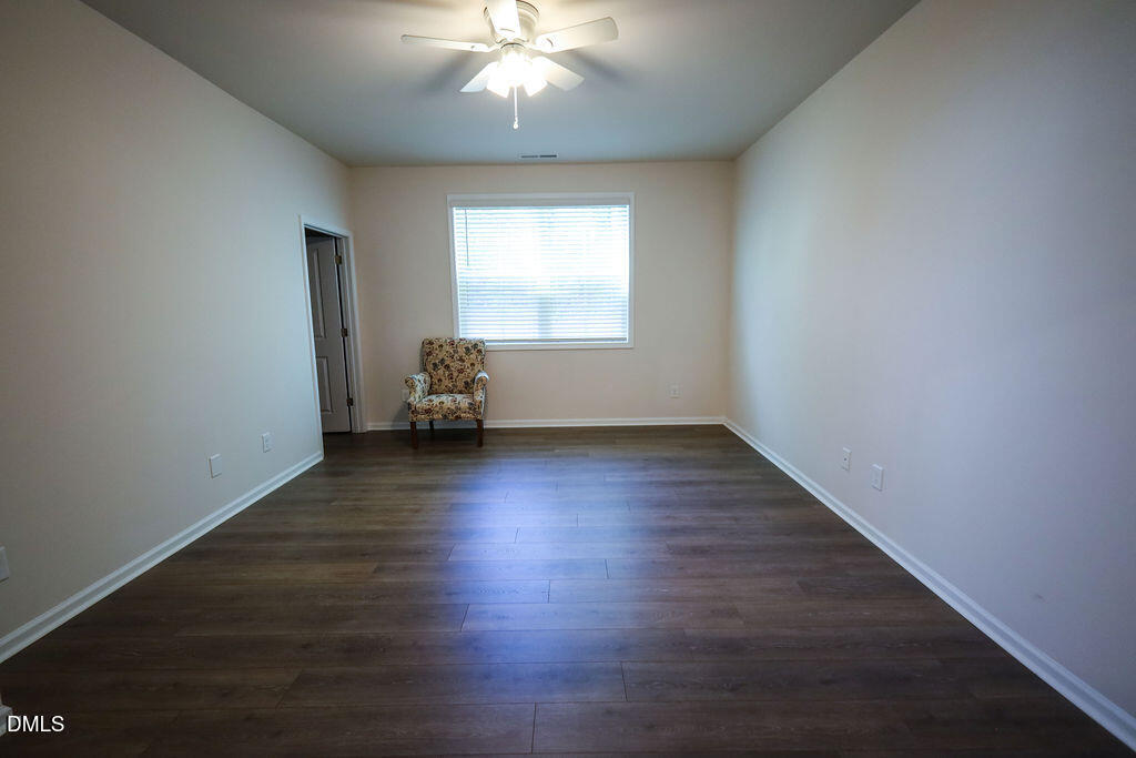 1644 Abberly Place Graham, NC 27253 - Photo 20 of 33 an empty room with wooden floor and windows